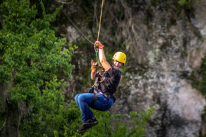 Person ziplning through the sky